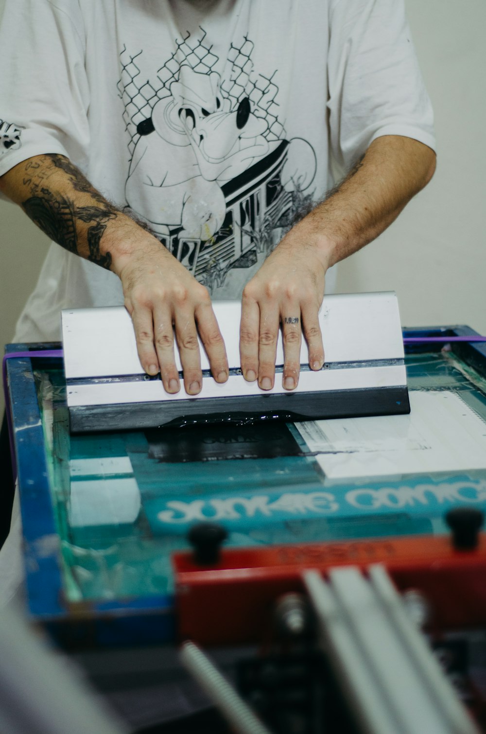 Same Day Printing in Upper Darby, PA Same-day t-shirt printing in progress at the press at Delaware County Shirt Printing, Upper Darby PA